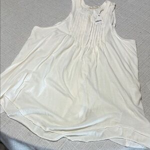 Creme Sleeveless Top
Free People size medium brand new